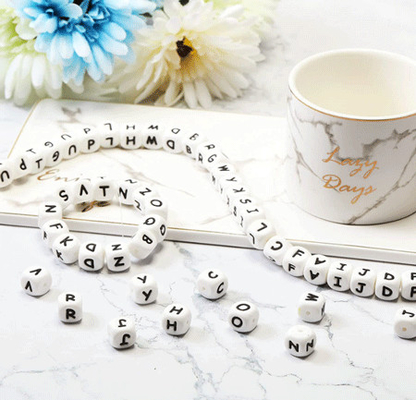 Perles libres non toxiques d'alphabet de silicone des jouets BPA de personne remuante de détente de mastication de bébé de 12MM